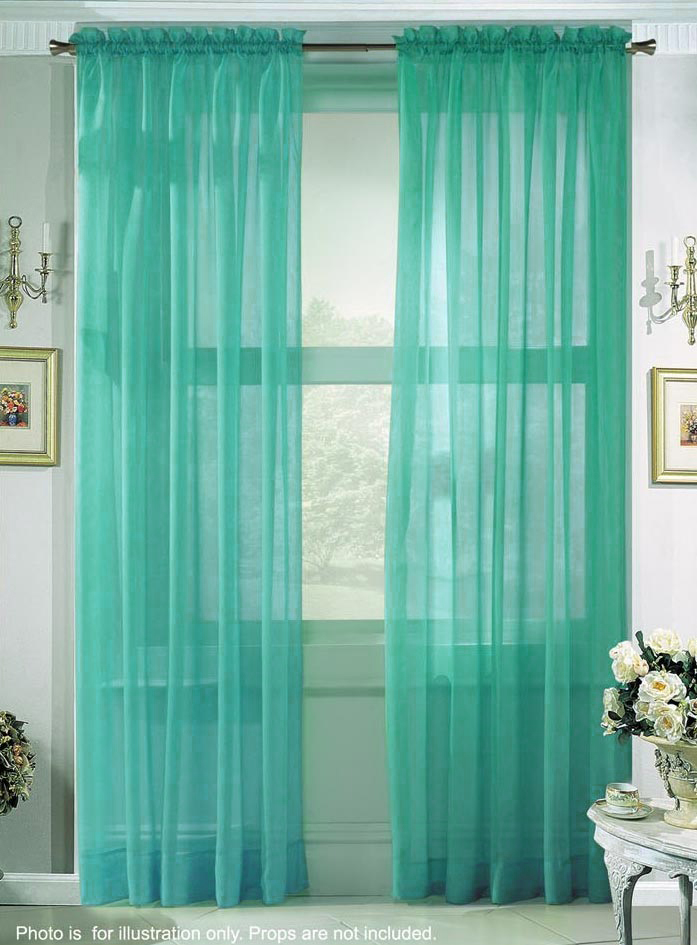 Remove the heavy drapery away and make the windows a focal point by using 